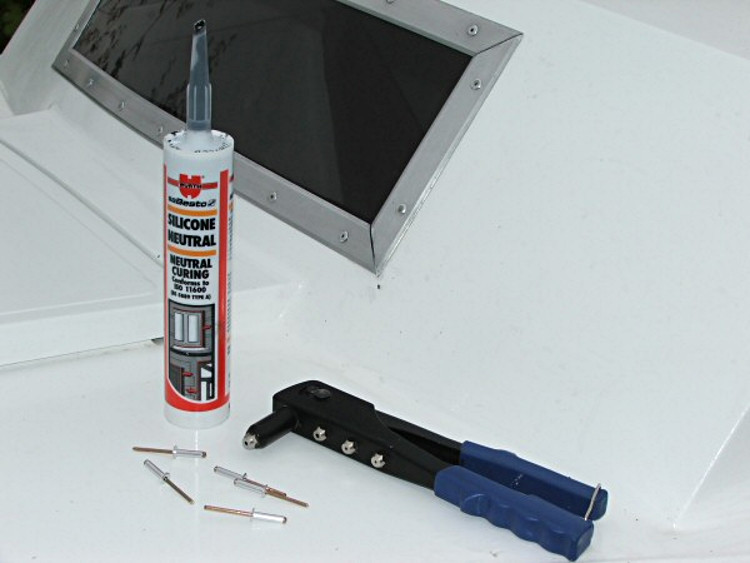 The sealant, rivets and gun used for the job